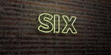 SIX -Realistic Neon Sign on Brick Wall background